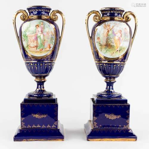 A pair of vases, with a transferprint decor. 20th C. (L: 18 ...