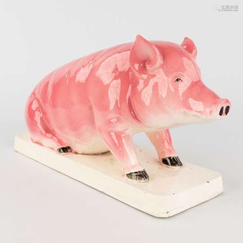 A pig, glazed faience. Circa 1900. (L: 13 x W: 40 x H: 22 cm...