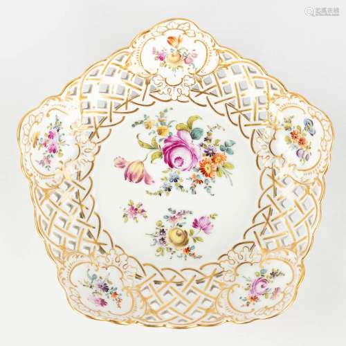 Meissen, a porcelain plate with ajoured rims and hand-painte...