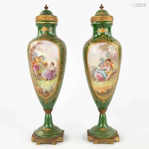 Sèvres, a pair of green vases with hand-painted decor and mo...