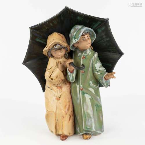 Lladro, 'Under The Umbrella' a figurine made of glazed stone...