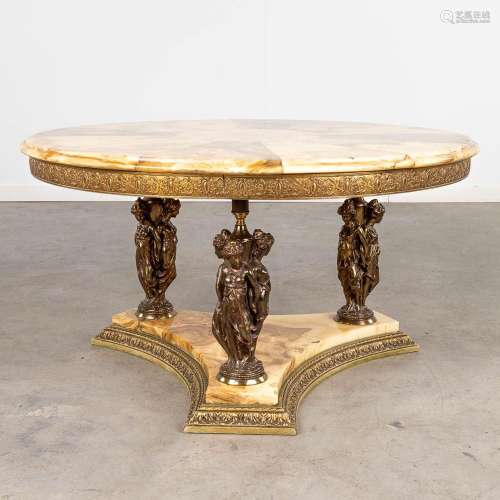 A coffee table with graces figurines, onyx and bronze. Circa...
