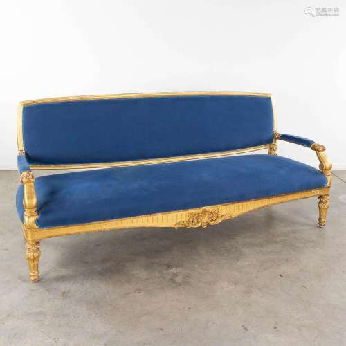 A large sofa, gilt sculptured wood upholstered with blue fab...