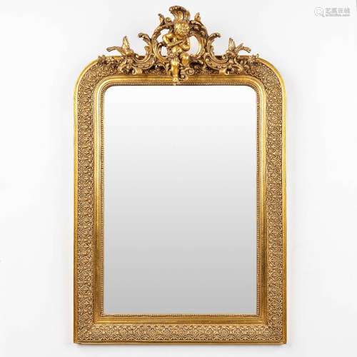 A mirror in a gilt frame, decorated with a musical putto. (W...