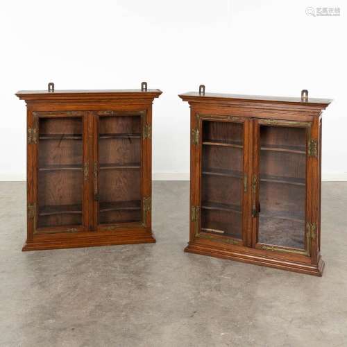 A pair of hanging cabinets, wood and glass. Circa 1900. (L: ...