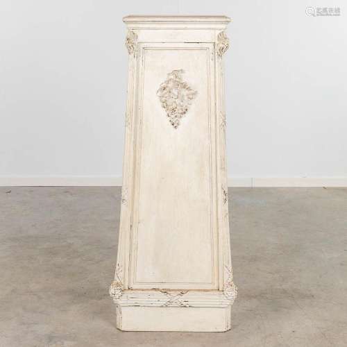 A white-patinated pedestal, decorated with grapes. Circa 190...
