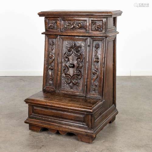 An antique Prayer cabinet, decorated with wood-sculptures, o...