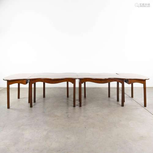 An English 4-piece mahogany dining room table, with two kidn...