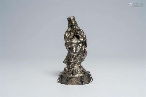 A presumably Spanish silver crowned Virgin Mary standing on ...