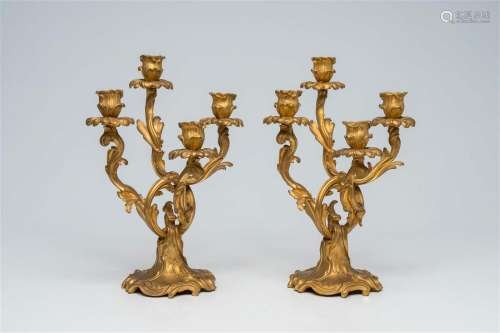 A pair of French Louis XV style gilt bronze four-light cande...