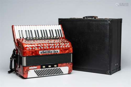 A  Czech 'Delicia' chromatic accordion with piano keyboard a...