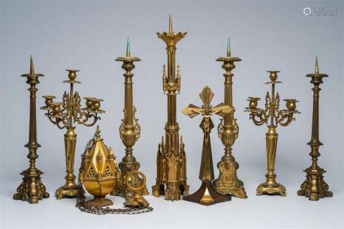 A varied collection of bronze and brass candlesticks, a thur...