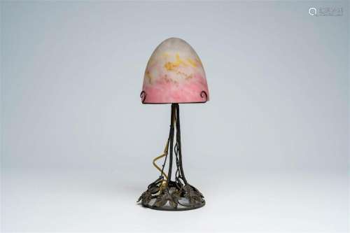 A French wrought iron 'mushroom' table lamp with a glass pas...