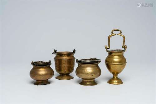 Four various brass holy water buckets or aspersoria, 17th C....