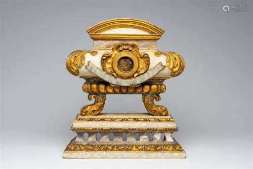 An Italian patinated and gilt wood Baroque tombe-shaped reli...
