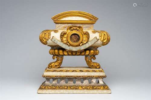 An Italian patinated and gilt wood Baroque tombe-shaped reli...