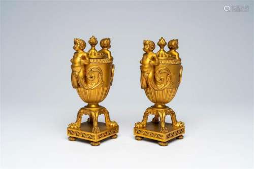 A pair of French gilt bronze vases and covers with bacchante...