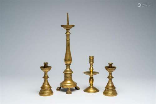 Four various bronze and brass candlesticks, 17th C. and late...