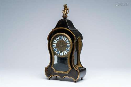 A French brass and bronze mounted ebonised wood cartel clock...