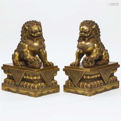 Pair of Buddhist Gilt Bronze Foo Dogs, early 20th century,
