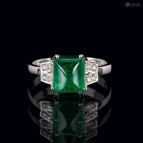 An Emerald Diamond Ring.