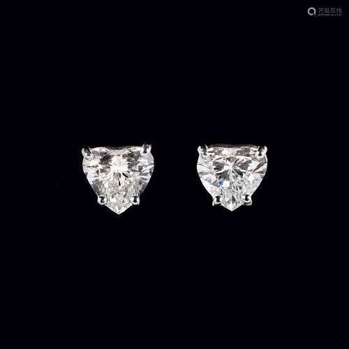 A Pair of rare-white Solitaire Heart Diamond Earstuds.