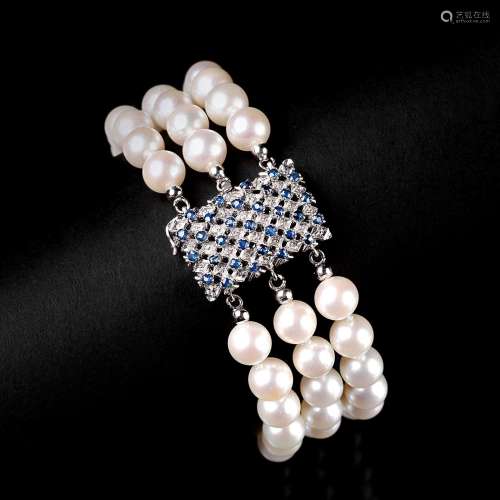 A Pearl Bracelet with Sapphire Clasp.