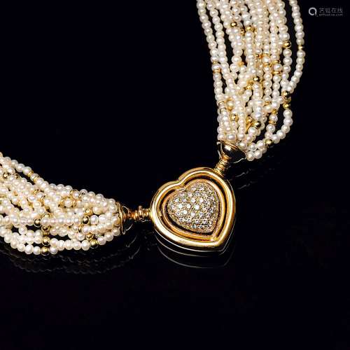 A Pearl Necklace with Diamond Heart Shaped Clasp.