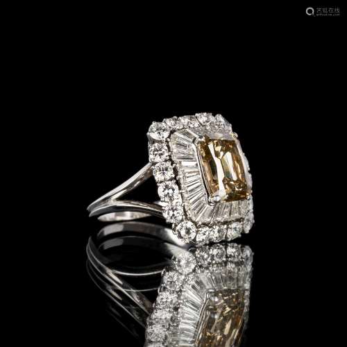 A highcarat Fancy Diamond Ring with Diamond Setting.