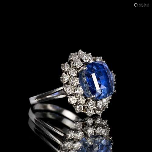 A colour-fine Sapphire Diamond Ring.