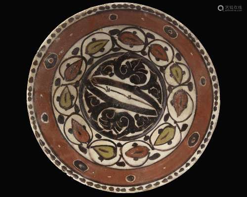 A SAMANID SLIP-PAINTED POTTERY BOWL, PERSIA, 10TH CENTURY