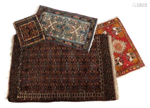 4 various hand-knotted carpets