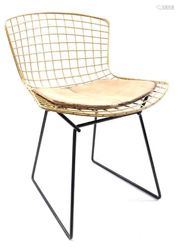 Gold colored metal wire chair