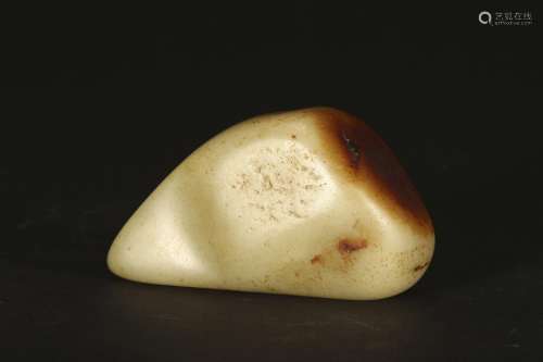 A WHITE AND RUSSET JADE INSCRIBED BOULDER