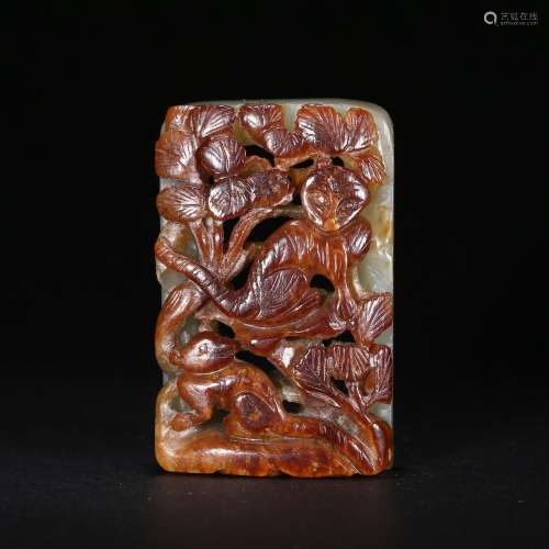 A BROWN AND RUSSET JADE PLAQUE