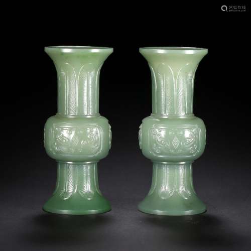 A PAIR OF CELADON JADE BEAKER VASES