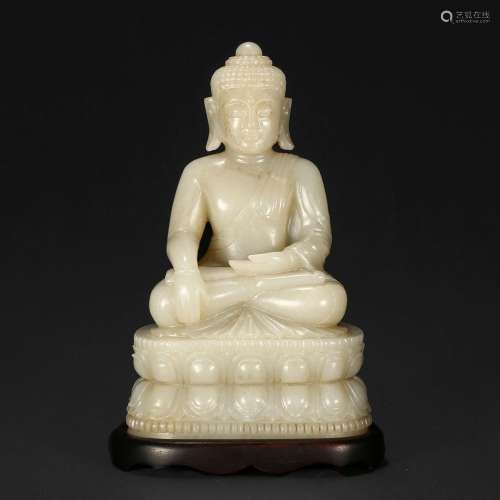 A WHITE JADE FIGURE OF SEATED SHAKYAMUNI