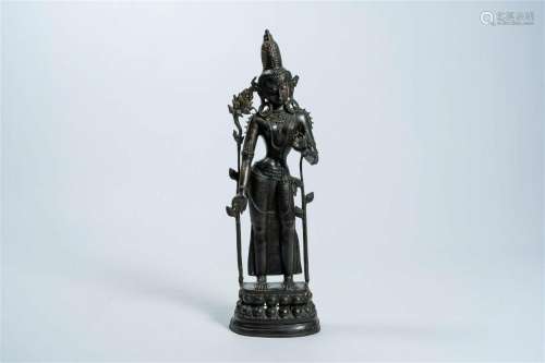 A large Nepalese patinated bronze figure of a standing Tara ...
