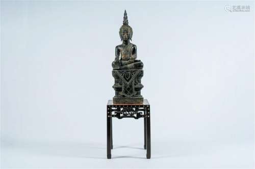 A Thai carved wood Buddha on a Chinese marble-topped wooden ...
