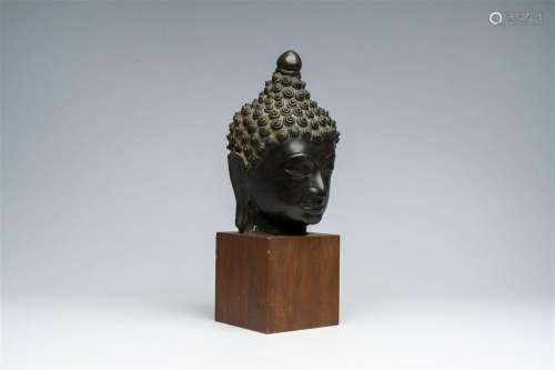 A patinated bronze head of Buddha, Burma or Thailand, 19th C...