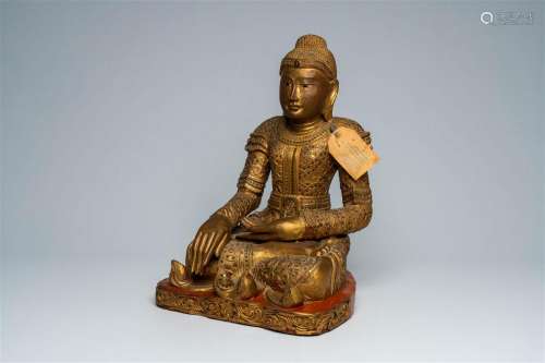 A tall Thai inlaid gilt wood figure of a seated Buddha, 20th...