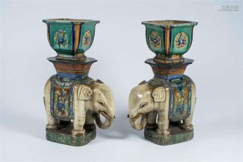 A pair of Chinese or Vietnamese polychrome pottery elephant-...