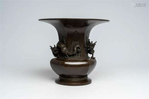 A Japanese patinated bronze vase with applied dragon design,...