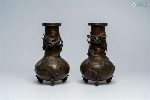 A pair of Japanese bronze relief decorated 'dragon' vases, M...