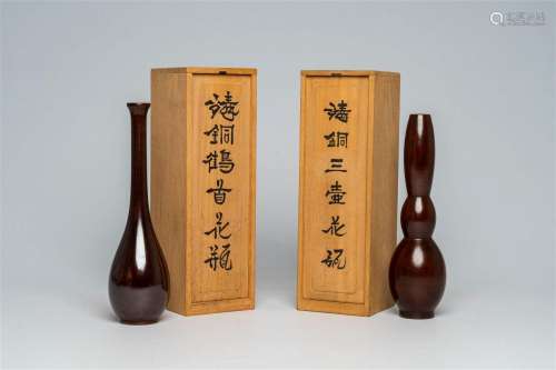 Two stylized Japanese chestnut brown patinated bronze vases,...