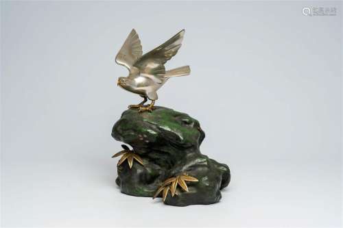 A Japanese patinated and silver-plated metal okimono of an e...