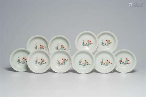Ten Japanese moulded Kakiemon style bowls with floral design...