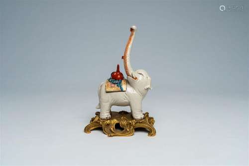 A Japanese Kutani model of an elephant bearing a tengu mask,...