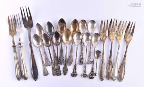 A group of silver cutlery
