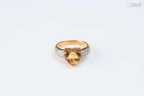An 18 carat white and yellow gold ring set with a heart-shap...